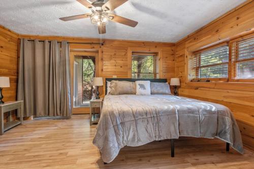 a bedroom with a bed and a ceiling fan at Your Getaway Oasis in Sevierville