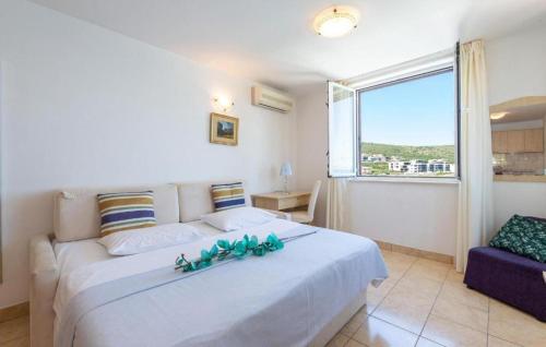 Posteľ alebo postele v izbe v ubytovaní Apartments Tamarix