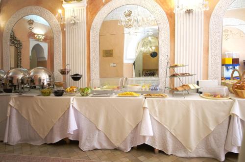 a table with food on it in a room at Riad Palais Des Princesses & Spa in Marrakesh