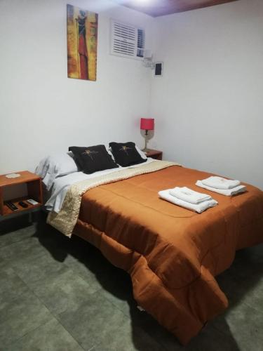 Кровать или кровати в номере Acuario Departamentos