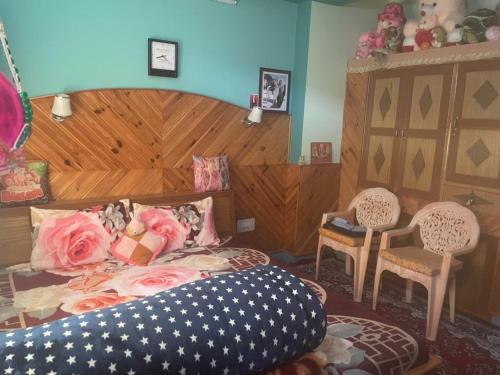 a bedroom with a bed with an american flag pillow at The hidden heaven homestay kalpa in Chini