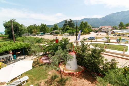 a view of a park with trees and a street at Smaro Studios in Chrysi Ammoudia