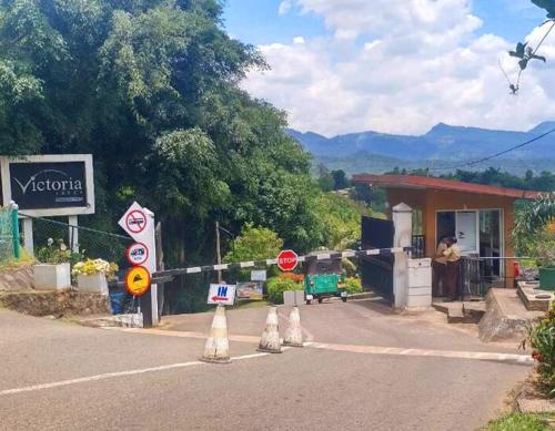 a road closure sign in front of a gas station at Victoria Range Holiday Villas in Kandy