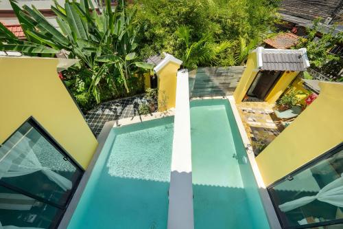 an overhead view of a swimming pool next to a house at Hoi An 2BR private Pool Villa - Walk to Old Town in Hoi An