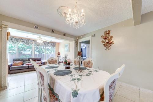 a dining room with a white table and chairs at 4 Mi to Hard Rock Stadium Miramar Home with BBQ! in Miramar