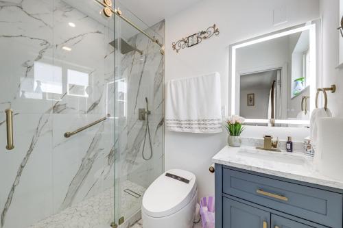 a bathroom with a shower and a toilet and a sink at 4 Mi to Hard Rock Stadium Miramar Home with BBQ! in Miramar