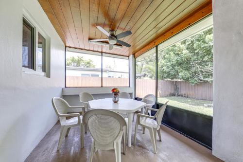 a dining room with a table and chairs and a ceiling fan at 4 Mi to Hard Rock Stadium Miramar Home with BBQ! in Miramar