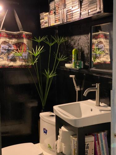 a bathroom with a sink and a toilet at PHẠM Homestay Ca Mau in Thới Bình