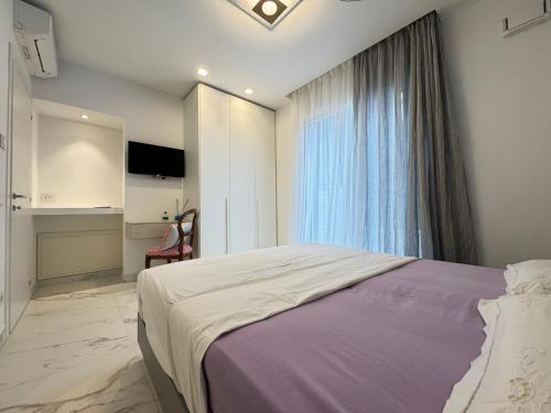 Ένα ή περισσότερα κρεβάτια σε δωμάτιο στο VILLA Porto Garibaldi