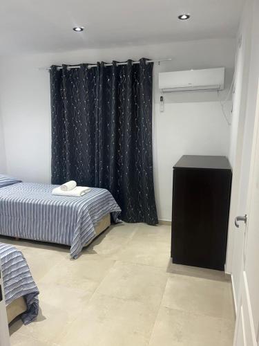 Ένα ή περισσότερα κρεβάτια σε δωμάτιο στο Cabañas del Fuego