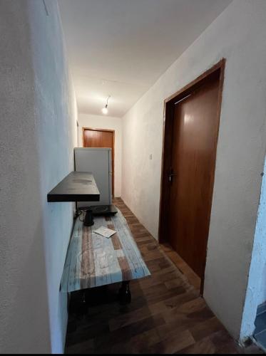 an empty room with a desk and a door at APARTMENTS Mir in Virpazar