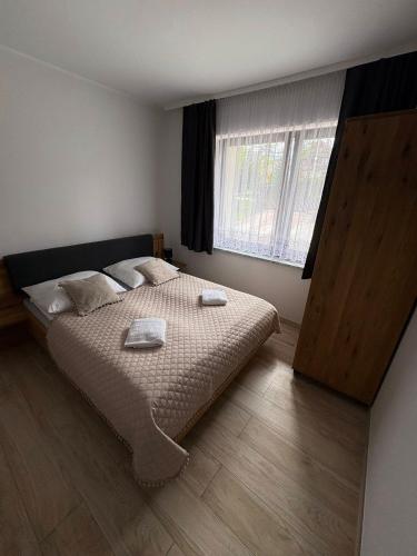 Postel nebo postele na pokoji v ubytování Apartament Miś