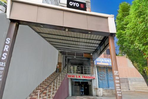 a building with a stairway leading up to a door at Hotel O SRS Inn Guest House in Gorakhpur