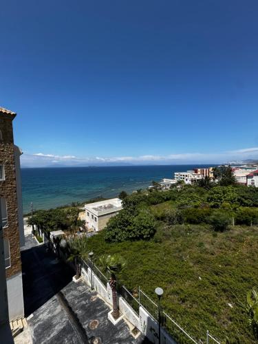 a view of the ocean from a building at Séjour Bab Diki in Melîyech