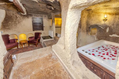 Postel nebo postele na pokoji v ubytování ARIEN CAVE Hotel