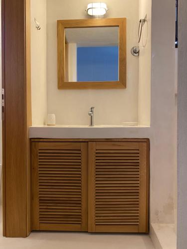 a bathroom with a sink and a mirror at Harmony Seaside Pelion in Platanias