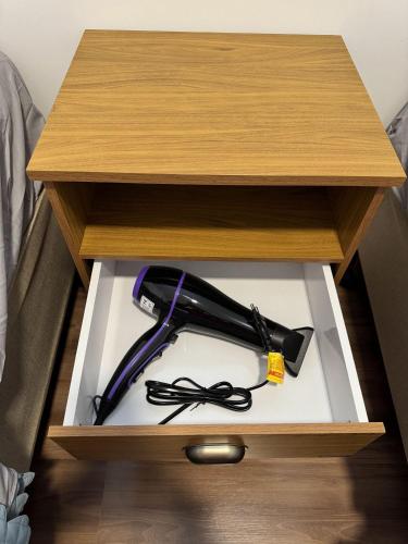a wooden drawer with a tool in it at Edifício Forte dos Lagos in Toledo