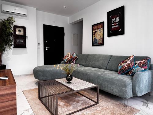 a living room with a couch and a table at little caifornia in Sidi Daoud