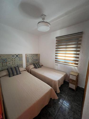 Postel nebo postele na pokoji v ubytování Apartamento Mari