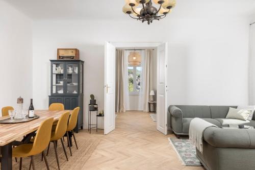 a living room with a table and a couch at Apartment Nina in Bakar