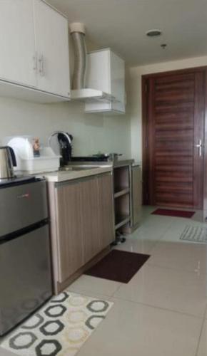 a kitchen with a sink and a counter top at Climax Point Apt in Mandaue City