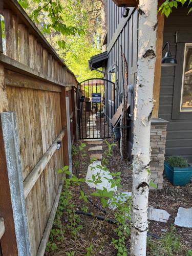 a fence in front of a house with a fence at Lake Tahoe Luxury Guest Quarters in South Lake Tahoe