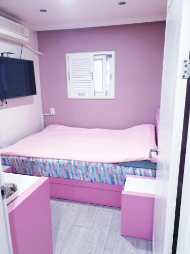 Кровать или кровати в номере Dreaming Hostel Sinchon Hongdae