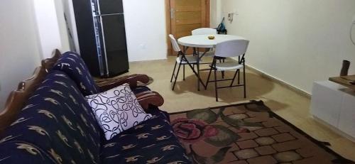 a living room with a couch and a table at grand hills in Dawwār ‘Abd Allāh