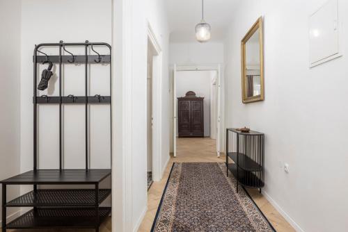 a hallway with a black table and a mirror at Apartment Nina in Bakar