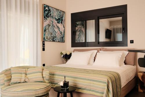 Giường trong phòng chung tại AELIA HORIZON VILLAS - Corinthia