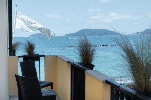 a balcony with a view of the ocean at Hotel Florida Lerici in Lerici