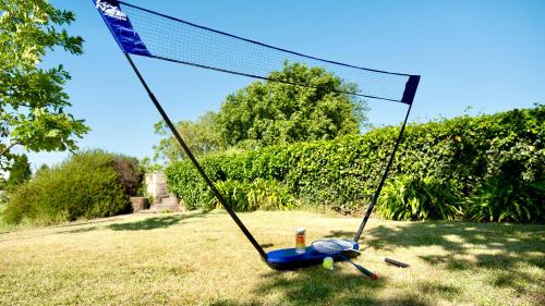 a swing in a field with a net at Quinta da Cumieira in Cumieira
