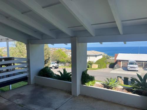 a porch with a view of a parking lot at Hallett Cove Sunset Getaway in Hallett Cove