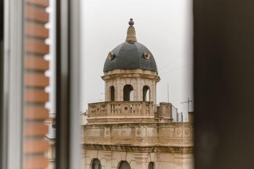 a building with a dome on top of it at Albaceteloft Avenida España in Albacete