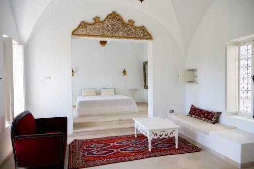 Rúm í herbergi á Dar Kalitoussa B&B Hammamet