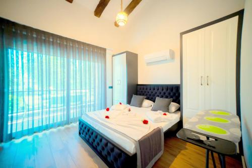 Кровать или кровати в номере Sweet Home Kemer Apartments