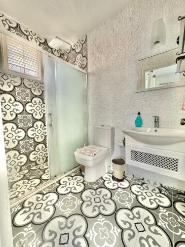 a bathroom with a toilet and a sink at Aişem By Hire in Alaçatı
