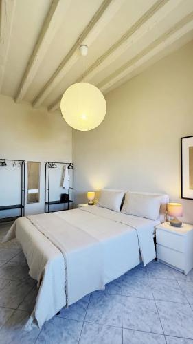 a large white bedroom with a large white bed at VISTA MARE IN CENTRO STORICO Casa di Sara in Sciacca