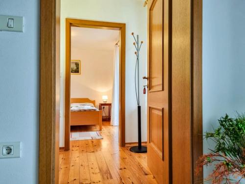 a hallway with a door leading to a bedroom at Apartmaji Čok in Bovec