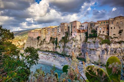 a view of the amalfi coast with buildings on the cliff at Blue Tide - Tropea in Tropea