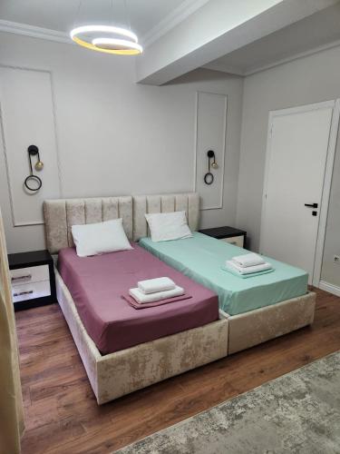 Bosko Vibe tesisinde bir odada yatak veya yataklar