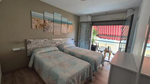 A bed or beds in a room at Atico Terraza, Airport-BCN, Puerto-Cruceros