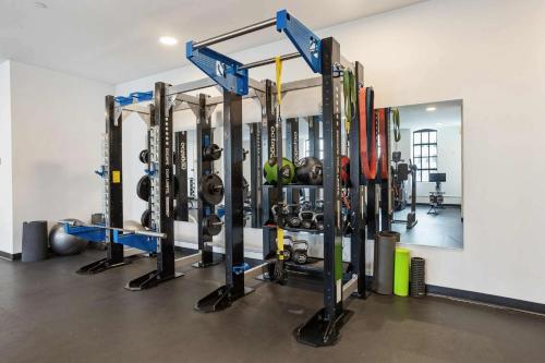 a gym with a bunch of equipment in a room at Optimum - Downtown Oasis in Birmingham
