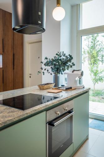 a kitchen with a sink and a stove top oven at Palase Elite Villas in Himare
