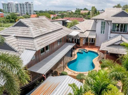 an aerial view of a house with a swimming pool at Luxury Iconic Royal Boat Pool Villa North Pattaya in Pattaya