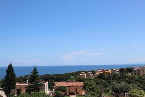 a view of a town with the ocean in the background at Casa Vacanze Sicilia Tirrena in Finale