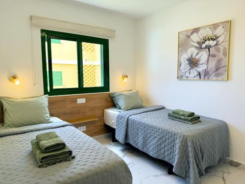 Ένα ή περισσότερα κρεβάτια σε δωμάτιο στο Las Olas Canarias