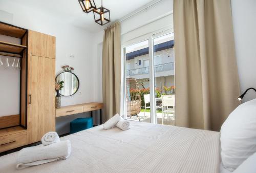 Postel nebo postele na pokoji v ubytování Ethra Apartment