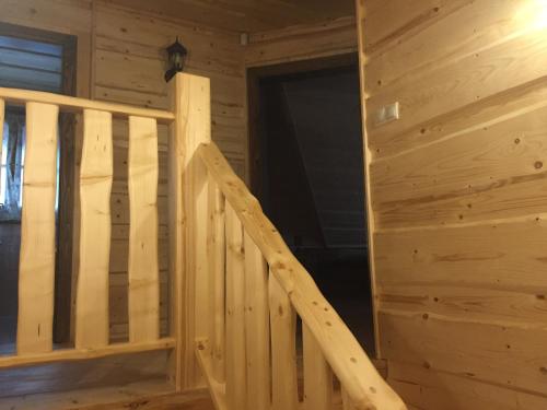 a wooden staircase in a log cabin at Drevenica Vanesa in Terchová