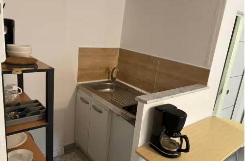 a small kitchen with a sink and a mixer at Fabuleux studio à 2 pas du Canal de l'Orne in Hérouville-Saint-Clair